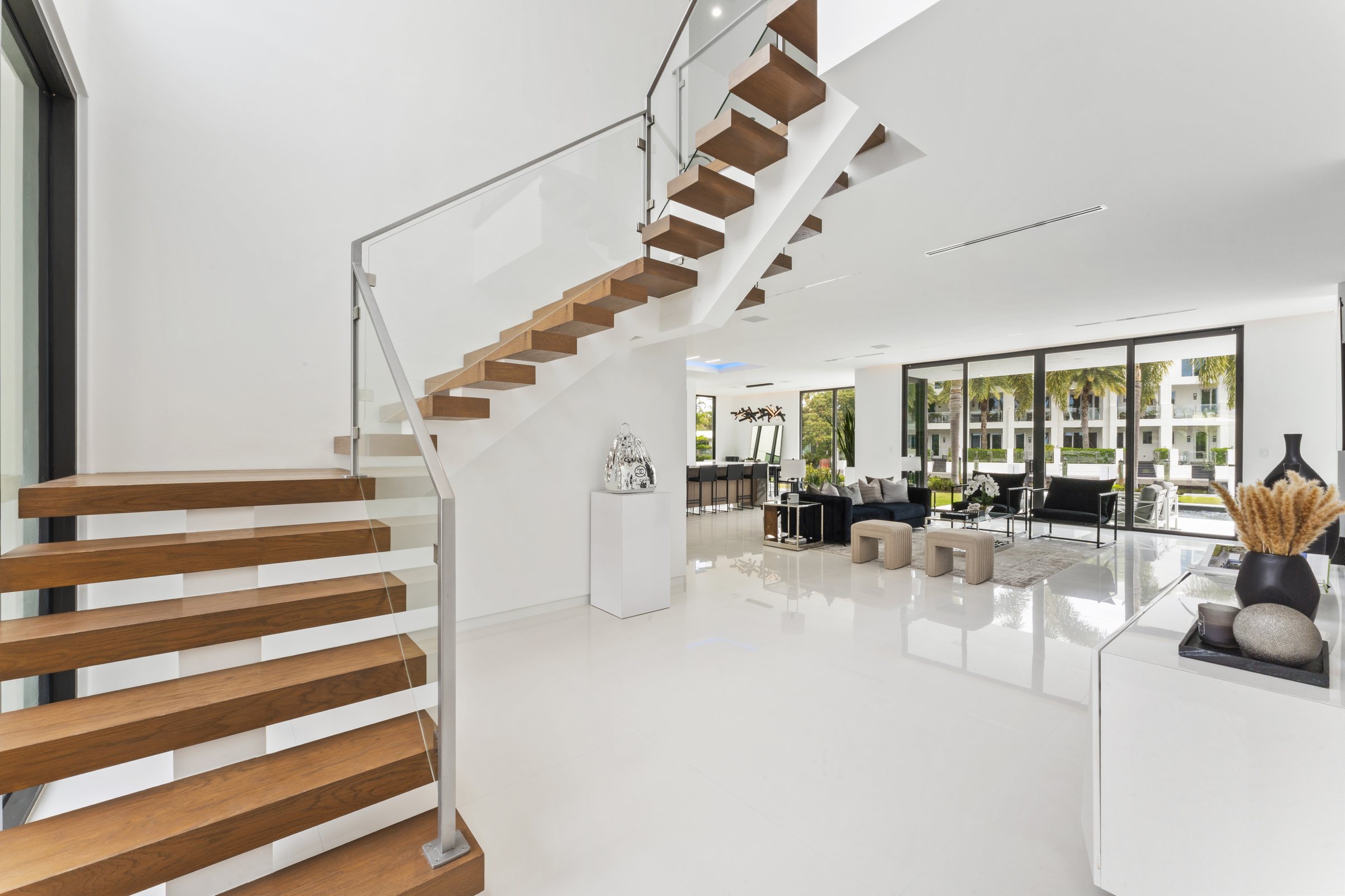 Entry and Sculptural Staircase at Casa Aqua, 4232 E Tradewinds Ave, Lauderdale-by-the-Sea