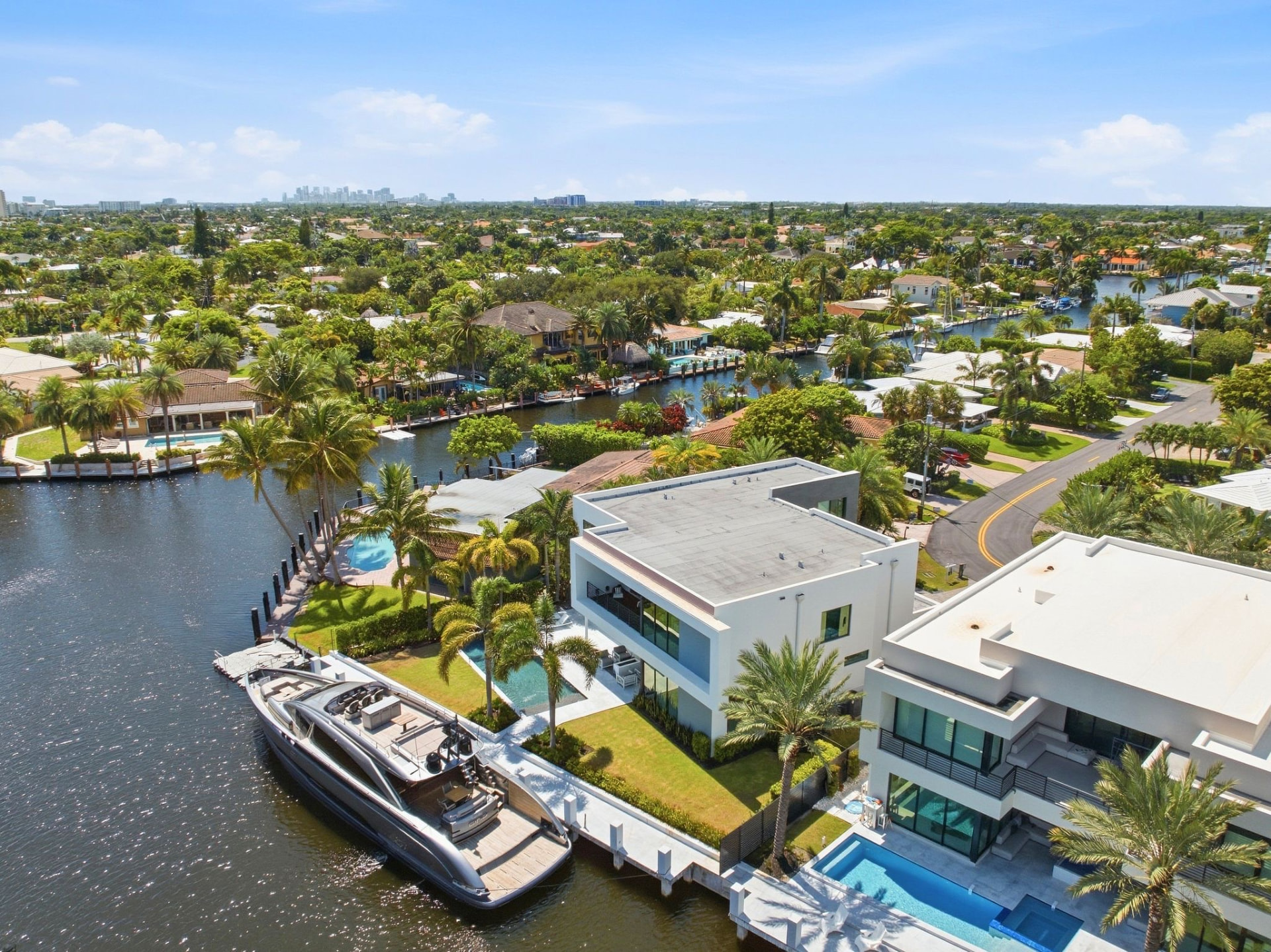 Aerial view along the canal toward Casa Aqua and its docked yacht